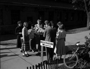 Women students confer with an orientation adviser before registration. (Image courtesy of Bentley Historical Library)