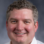 headshot Stephen C.J. Parker