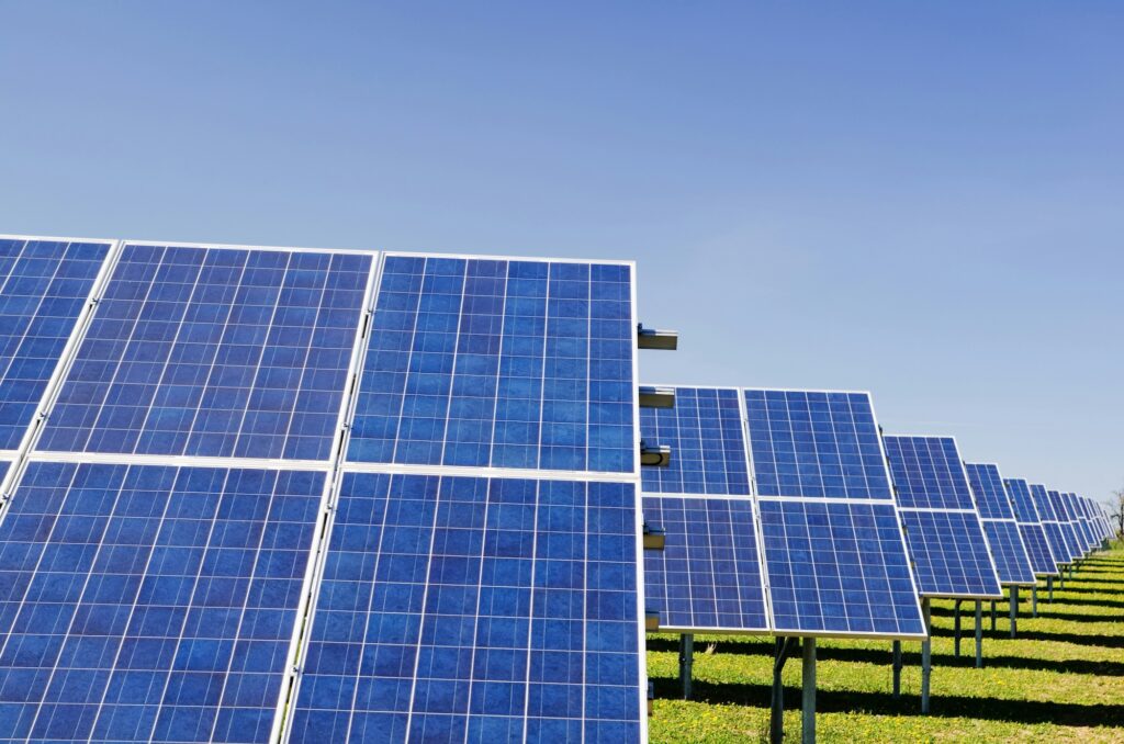 Blue solar panel boards. Image credit: Zbynek Burival, Unsplash