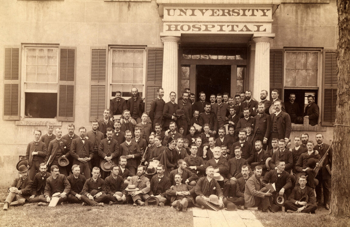 A photo of members of the U-M Medical School class of 1885 pose on the front steps of the nation's first university hospital