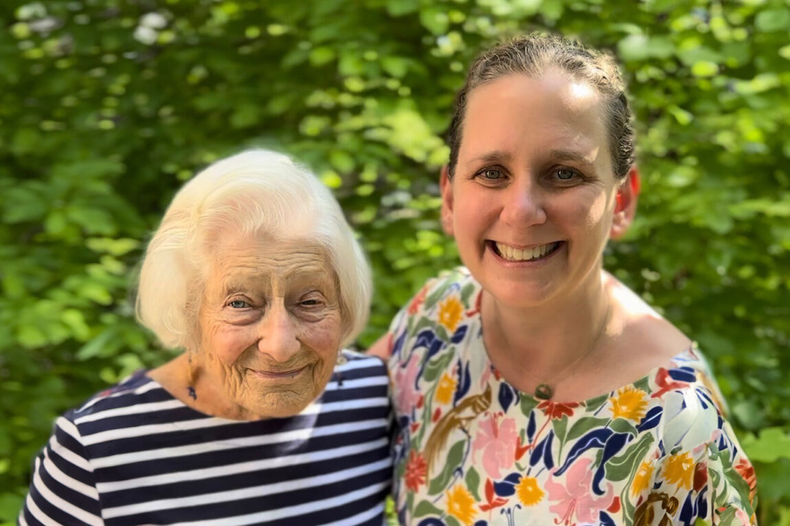 Photo of Irene Butter and Kate Bauer posing together in Bauer’s home