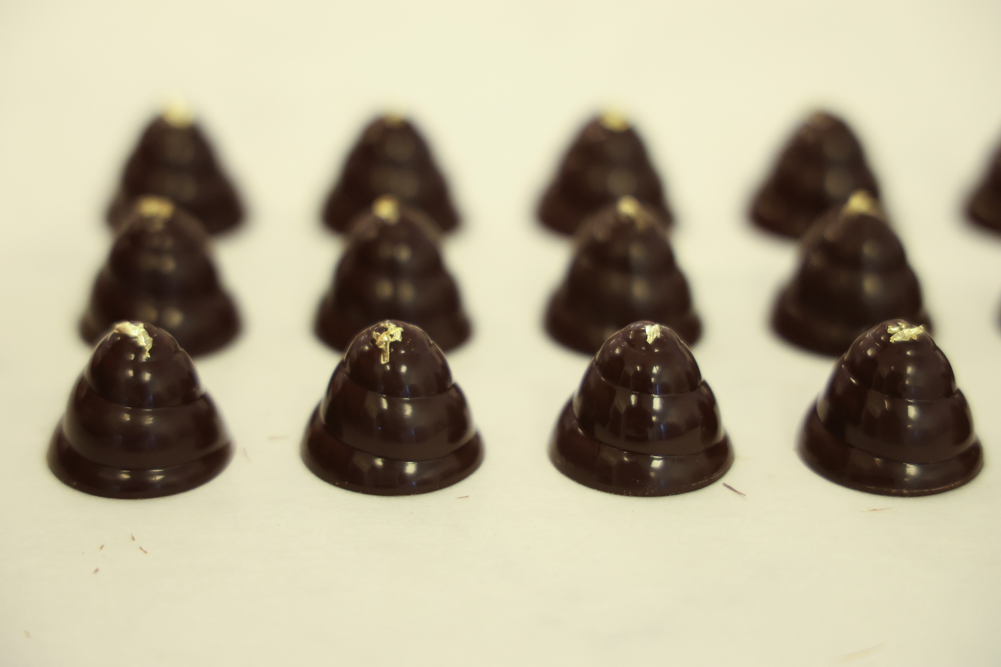 Happy Hive Honey Chocolates—a tiny chocolate beehive filled with honey ganache and decorated with 22 karat edible gold leaf. Image credit: Jeremy Marble, Michigan News