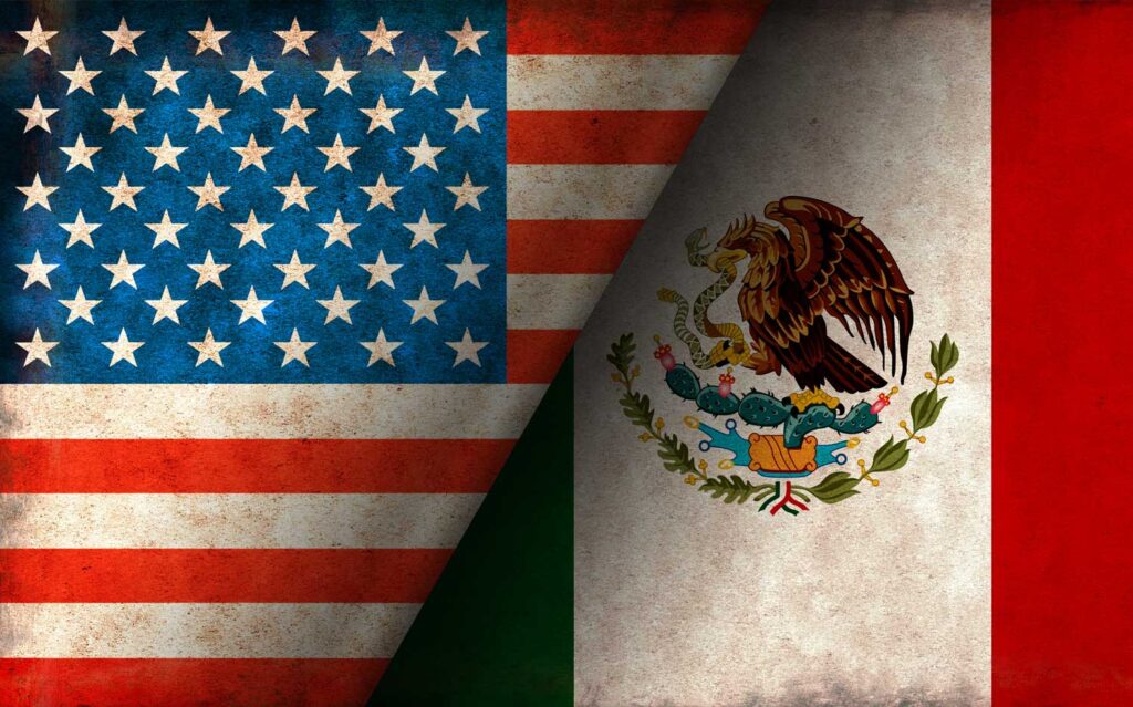 Grunge overlapping U.S. and Mexico flags. Image credit: iStock