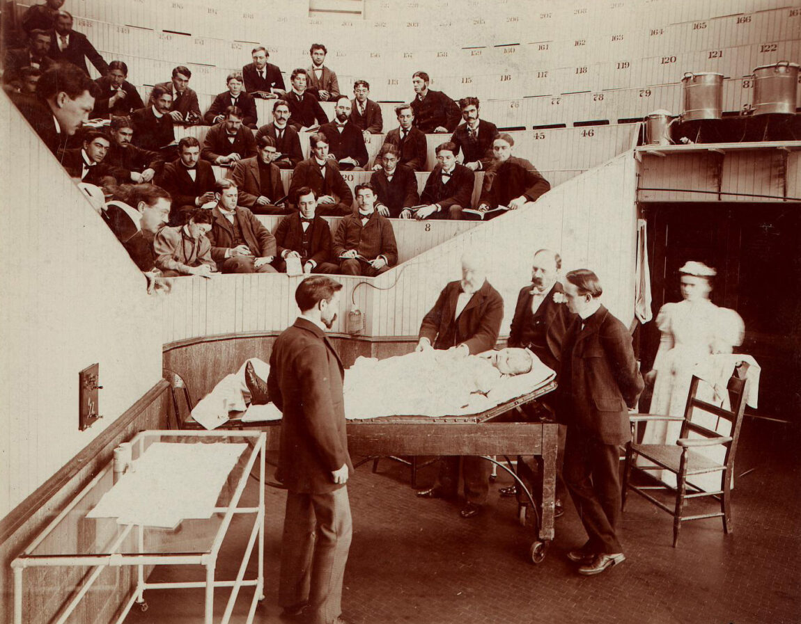 A photo of a teacher and students