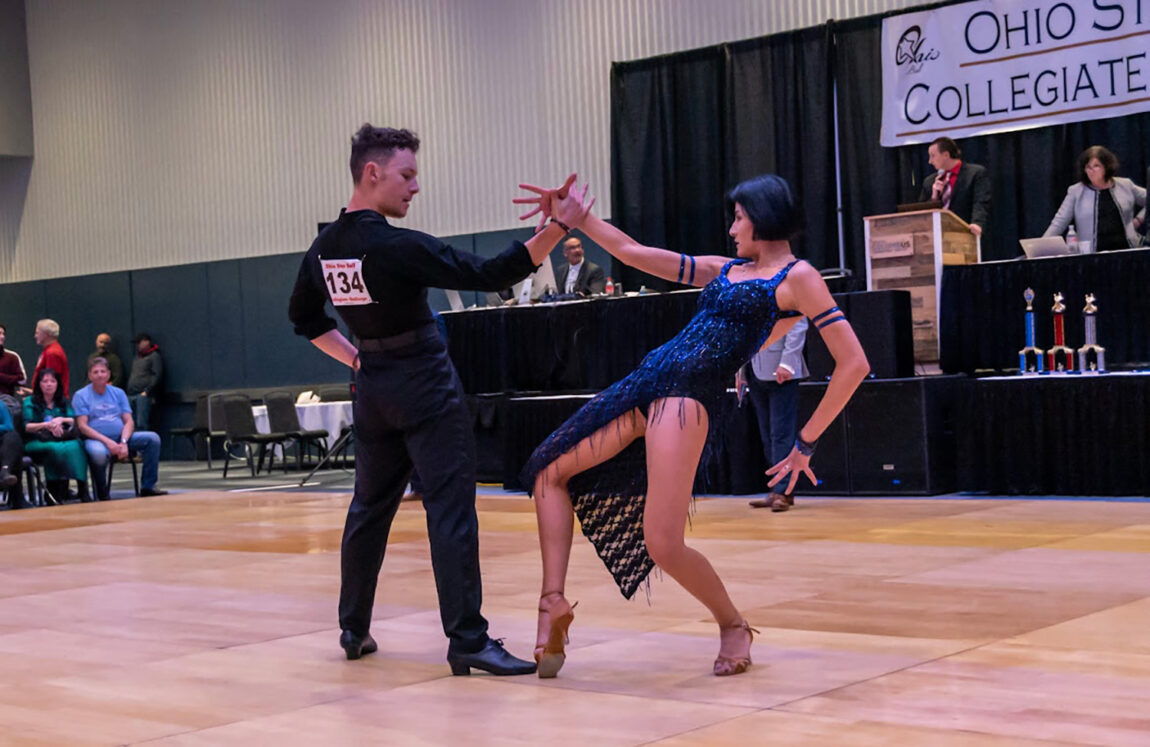A photo of a man and woman ballroom dancing