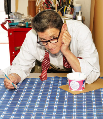 A photo of a person painting on fabric