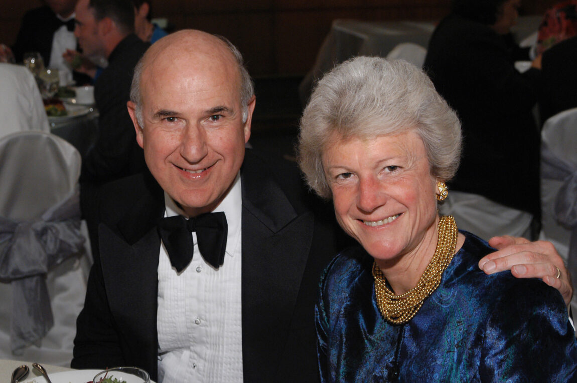 A photo of a man and a woman in formalware.
