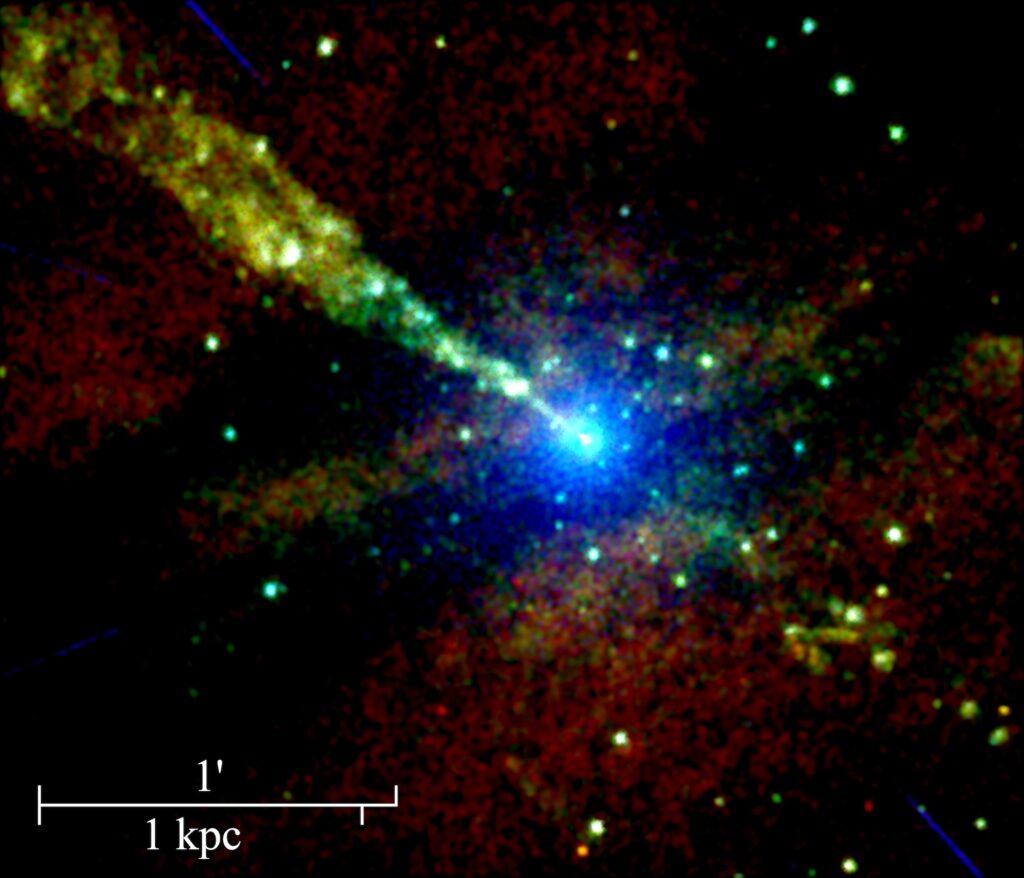 A narrow band, or jet, streaks diagonally in this composite image from an X-ray telescope from a bright central point, which is the active galactic nucleus of Centaurus A.