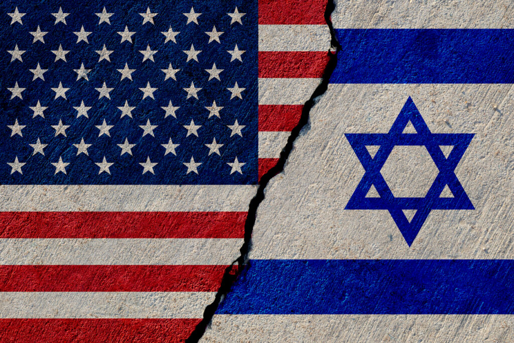USA and Israeli flags painted on concrete wall. Image credit: iStock