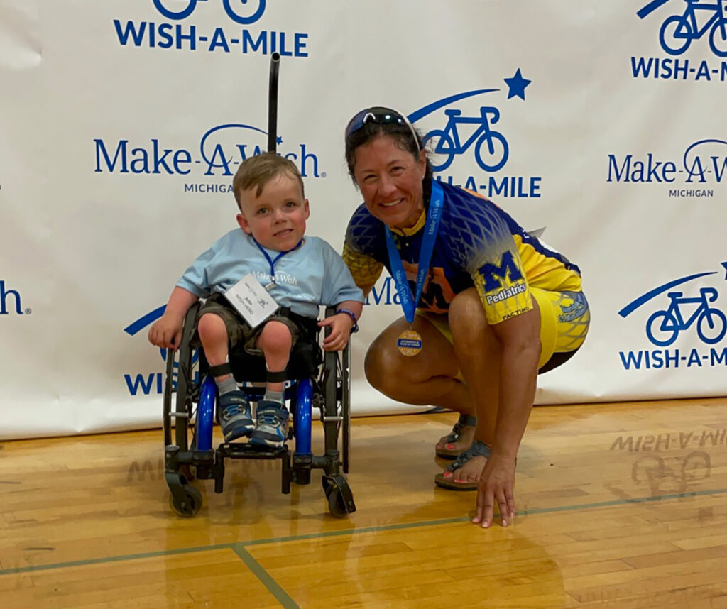 A photo of a woman with a child in a wheelchair