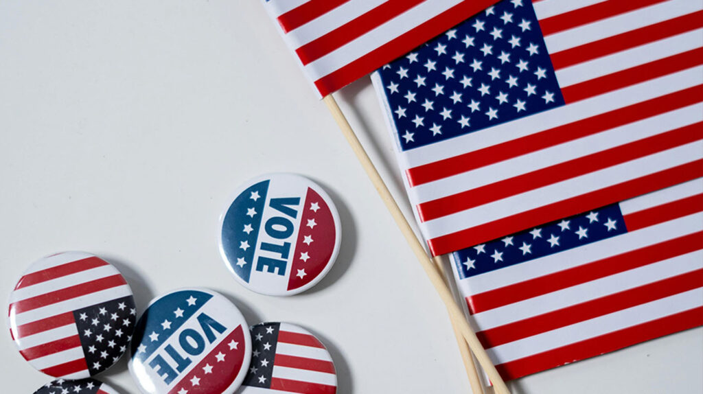 Vote buttons with an American Flag. Image credit: cottonbro studio, Pexels.com