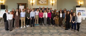 A group of more than 30 University of Michigan students and faculty gather for a photo with the U.S. Secretary of the Interior Deb Haaland.
