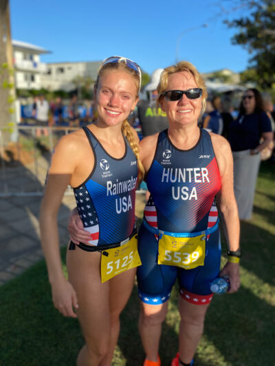 A photo of two women standing next to each after an aquathlon competition