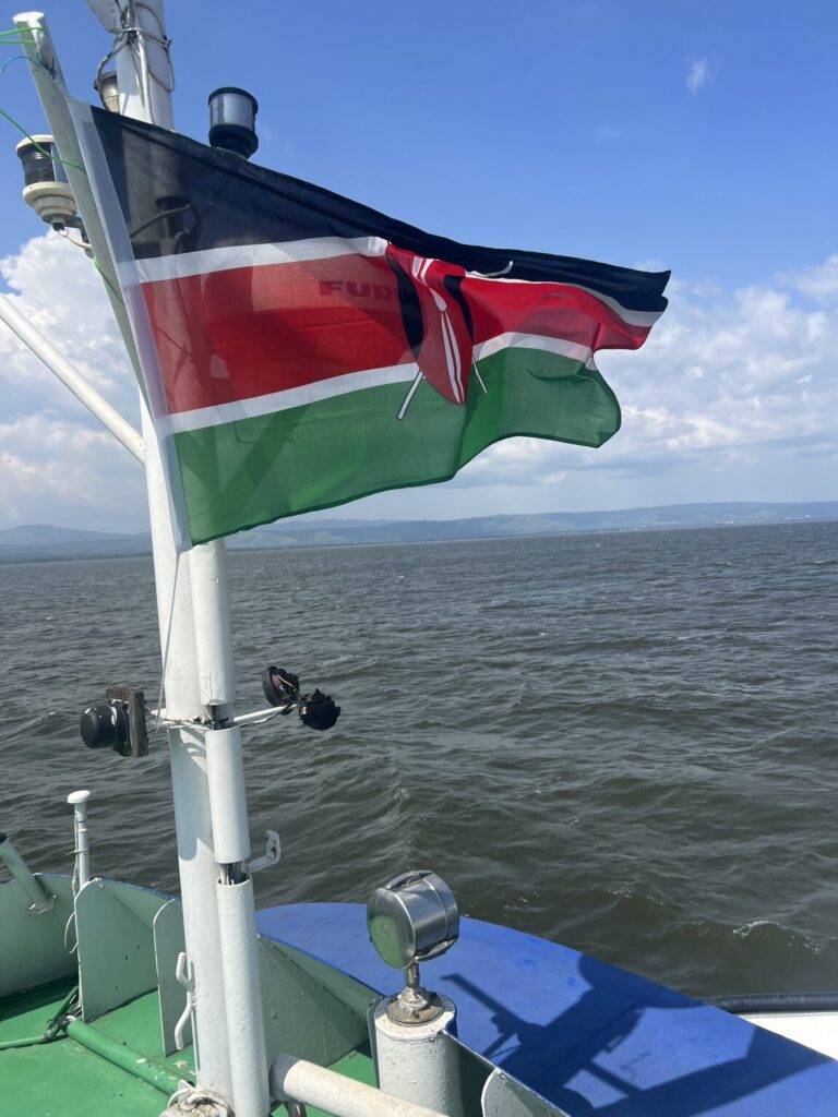 The Kenyan flag flies aboard a vessel used to sample different sites across Lake Victoria's Winam Gulf for different types of cyanobacteria. An international research team including scientists from the University of Michigan recently completed a genetic survey of cyanobacteria in the lake, which will help local officials track potentially dangerous cyanobacterial harmful algal blooms. Image credit: Lauren Hart, University of Michigan