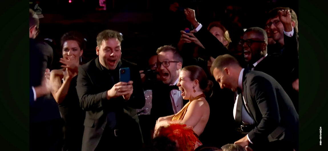 A photo of people celebrating after being named winners of a Grammy