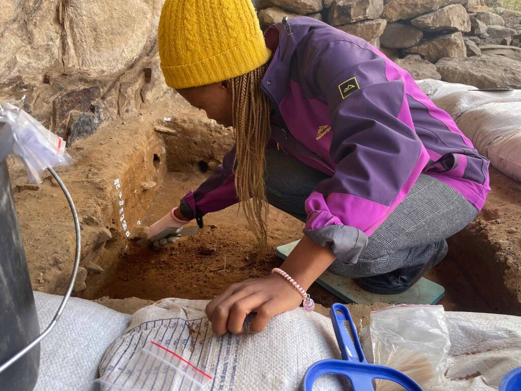 Masotho archaeologist Nthabileng Rantso excavates 50,000 year-old layers at Ha Soloja Rock-shelter, highland Lesotho.