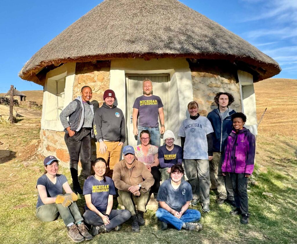 University of Michigan archaeologist Brian Stewart, colleagues, local collaborators, and U-M archaeology field school students at their Thamatu Lodge dig house near Ha Soloja Rock-shelter, Lesotho.