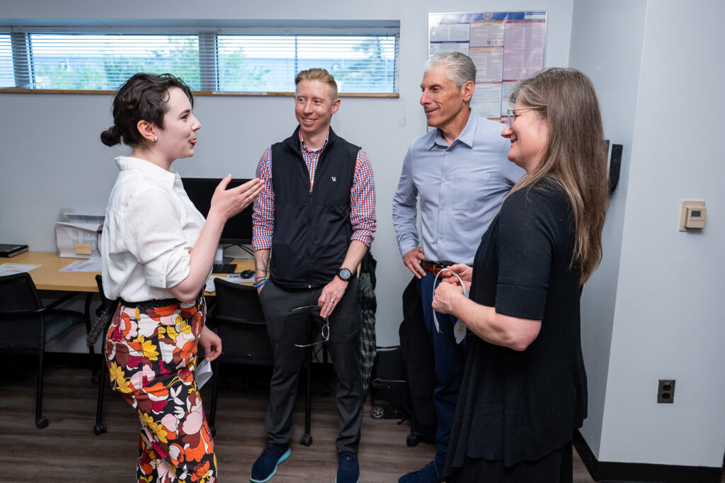 Four people talking to each other