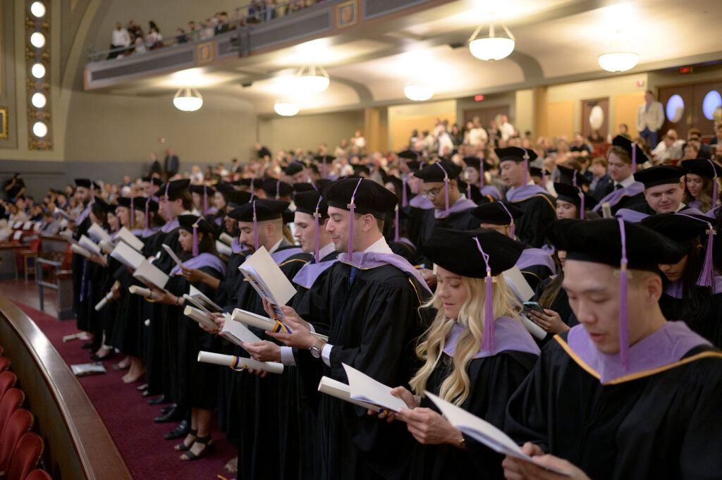 Dental school graduates recite the The Dentist’s Pledge during the 2025 commencement ceremony at Hill Auditorium.