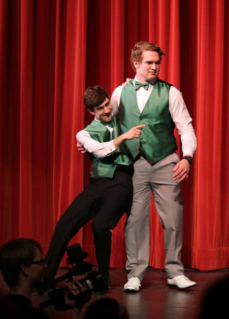 JT Godfrey performing in a high school show.