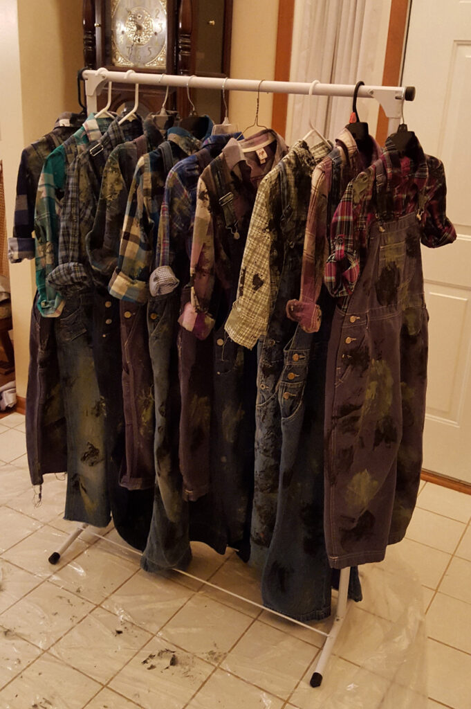 Rack of painted miners' costumes
