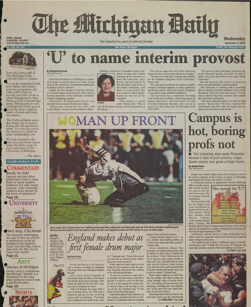 The cover of the Sept. 5, 2001, issue of The Michigan Daily features England doing the traditional drum major back bend after leading the U-M band into Michigan Stadium. 
