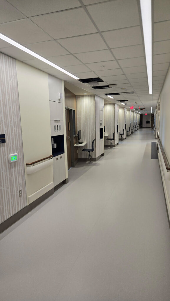A view of a long hallway of a new hospital