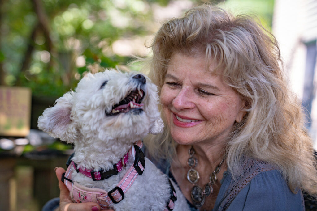 Sanders and Buddy, one of the farm’s two therapy dogs, share a moment.