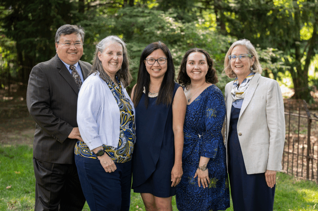Sung (center), at the Annmarie Hawkins Research Professor in Disability Justice Installation Event, Sept. 18 at the School of Social Work. Also shown, left to right: Neil Hawkins, Annmarie Hawkins, Rachel Hawkins (daughter of Neil and Annmarie, and Beth Angell, dean, School of Social Work.