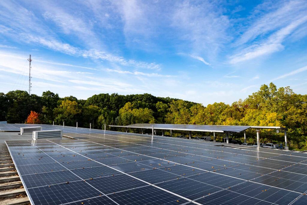 Two new solar installations at U-M's North Campus Facilities Services Building include both a rooftop array and a solar carport. The panels are part of the Maize Rays initiative, a multiyear plan to expand on-campus solar capacity, enhance energy resilience, and reduce the university's carbon footprint. Image credit: Eric Bronson, Michigan Photography