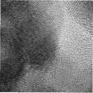 A gray-scale microscope image of gold metal resembles a wavy layer of beads.