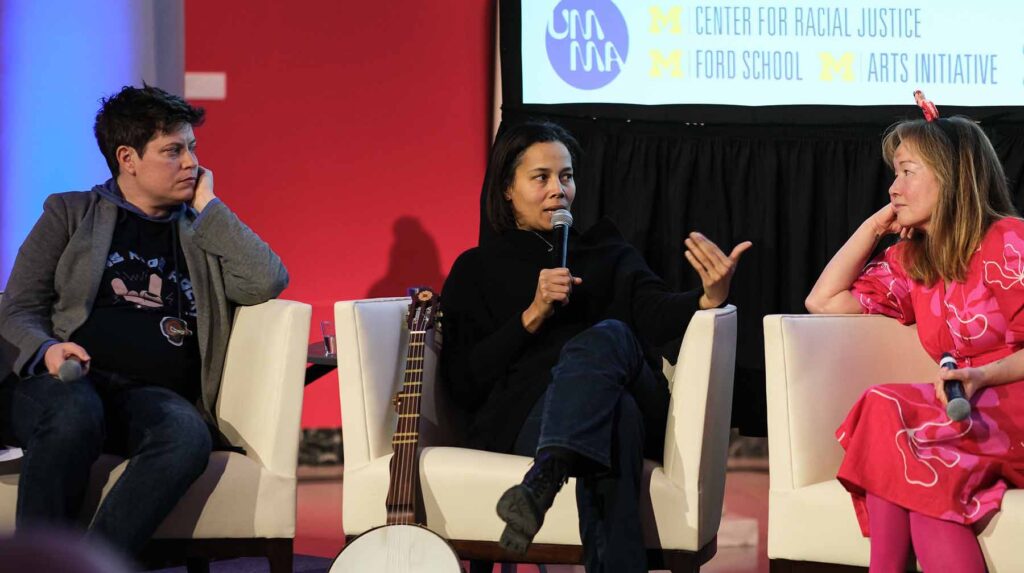 Rhiannon Giddens participating in Take Care: Democracy, Art & Healing panel with U-M director of arts research / creative practice Clare Croft (left) and visiting artist Philipa Hughes (right). Image courtesy: UMMA