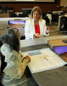 Professor Deborah Lee is preparing materials for the hands-on activity at the participants’ table. Image credit: Juan Ochoa 