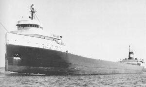 The Edmund Fitzgerald riding the Great Lakes. Black and white.