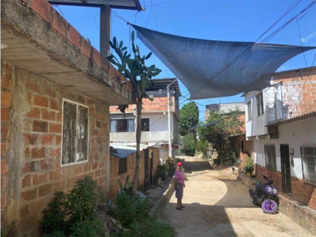 A street in Bucaramanga, Colombia cooled by a shade hung overhead