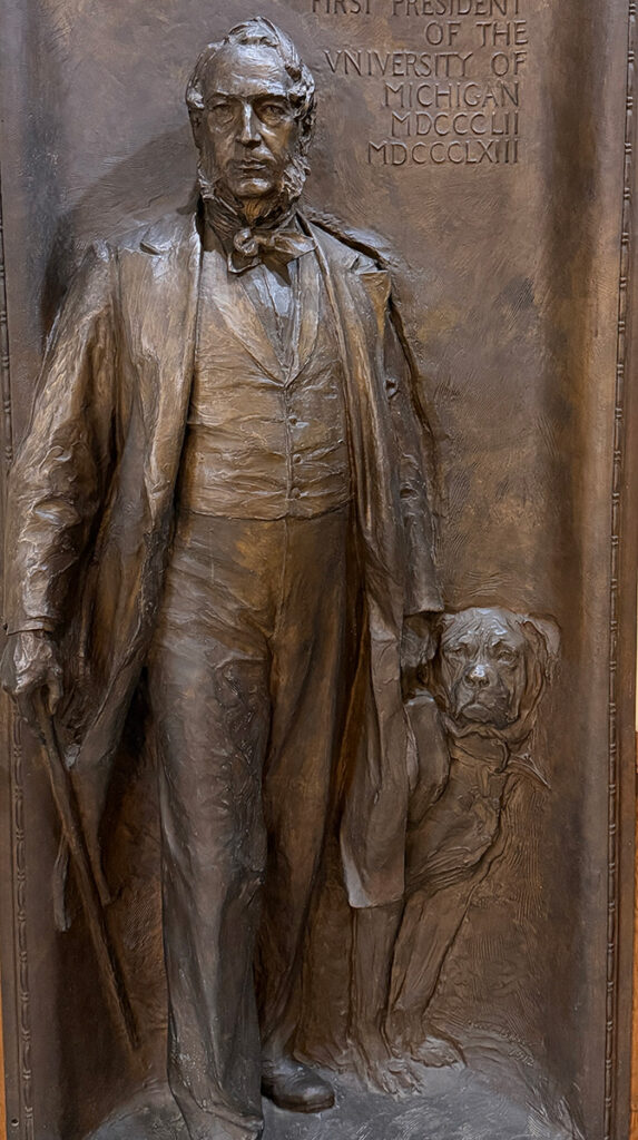 A bronze relief of President Tappan and his dog Leo