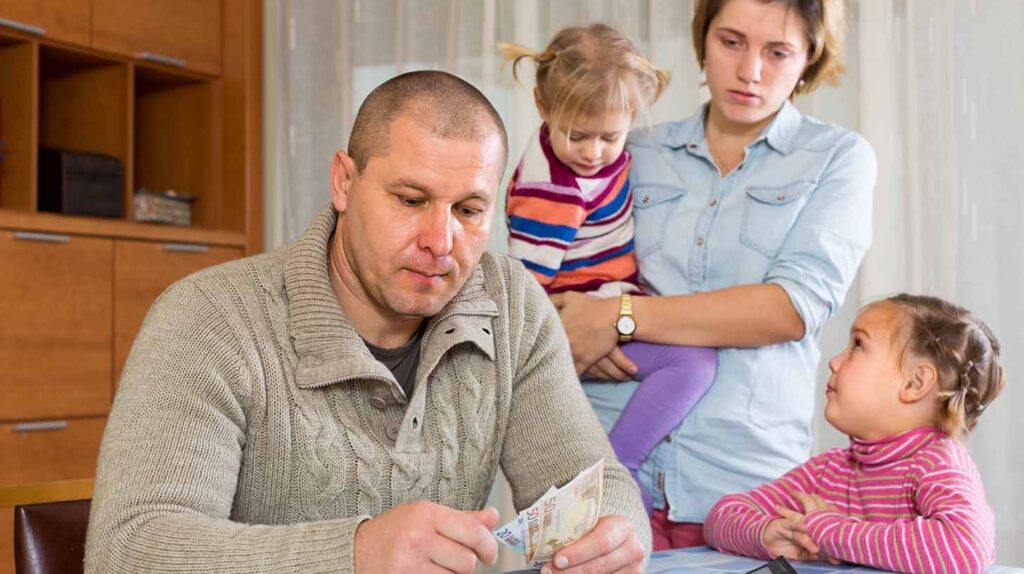 A family struggling with financial hardship. Image credit: Adobe Stock