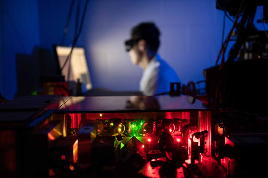 A scientist performs single molecule fluorescence microscopy in the Single Molecule Analysis in Real-Time (SMART) Center directed by Nils Walter, co-director of the Center for RNA Biomedicine at the University of Michigan. Image credit: Austin Thomason, Michigan Photography