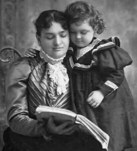 19th century portrait of woman and daughter posed as if reading a book.