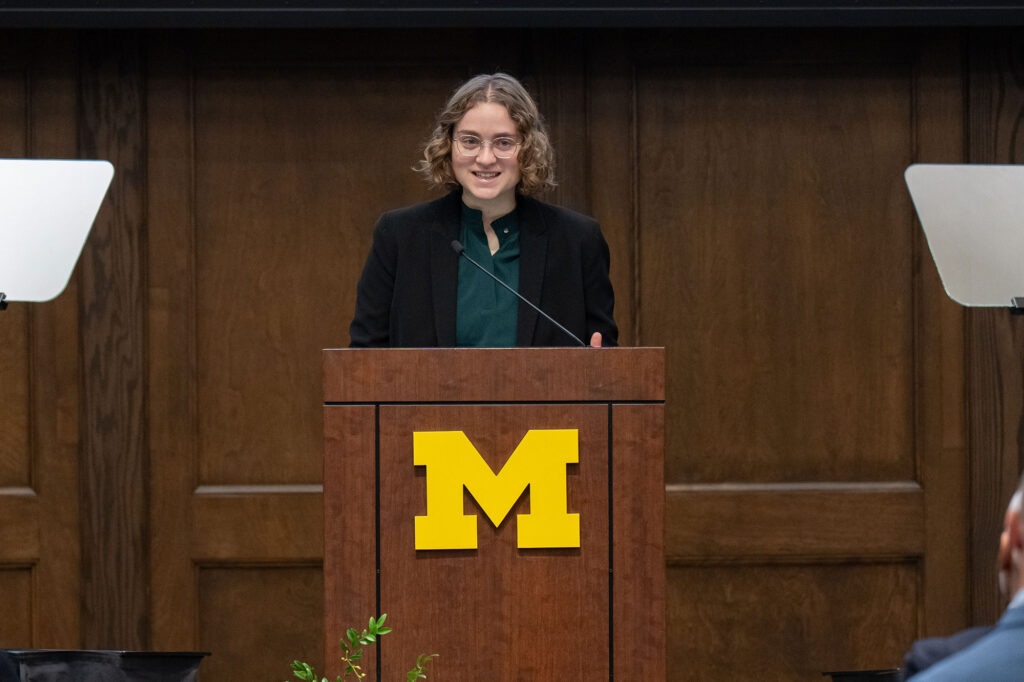 Woman at podium talking
