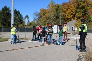 Student assistant Ava Rawley is explaining intersection safety guidelines. Image credit: Juan Ochoa