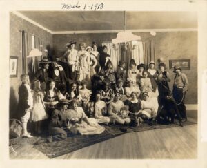 Group portrait of Collegiate Sorosis 'sisters' at a costume party taken in 1913. Back and white.