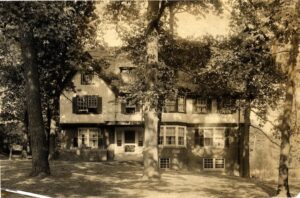 Black and white image of a Tudor house on Washtenaw Avenue in Ann Arbor that was home to the Collegiate Sorosis.