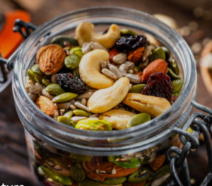 A mason jar filled with trail mix.