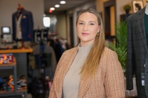 Jessica Bazner, owner of Kevin James Menswear, was able to receive help building an ecommerce website to draw business from a wider area after two DTE coal powered plants closed in the area. Image credit: Jeremy Marble, University of Michigan News