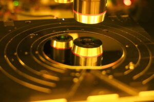 A silicon wafer is sitting on the chuck of the reflectometer KLA Filmetrics F54 which is a metrology tool used to measure the thickness of thin films. Image credit: Jeremy Marble, Michigan News
