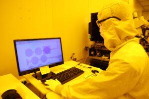 A person inside the LNF cleanroom facility is checking the final details of their layout file before starting the exposure process to a silicon wafer. Image credit: Jeremy Marble, Michigan News