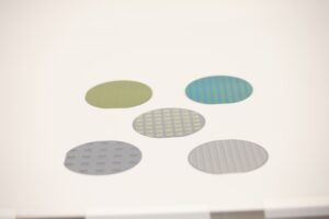 Five different 100 mm silicon wafers which is a common platform for fabricating a wide variety of devices at the LNF. Image credit: Jeremy Marble, Michigan News