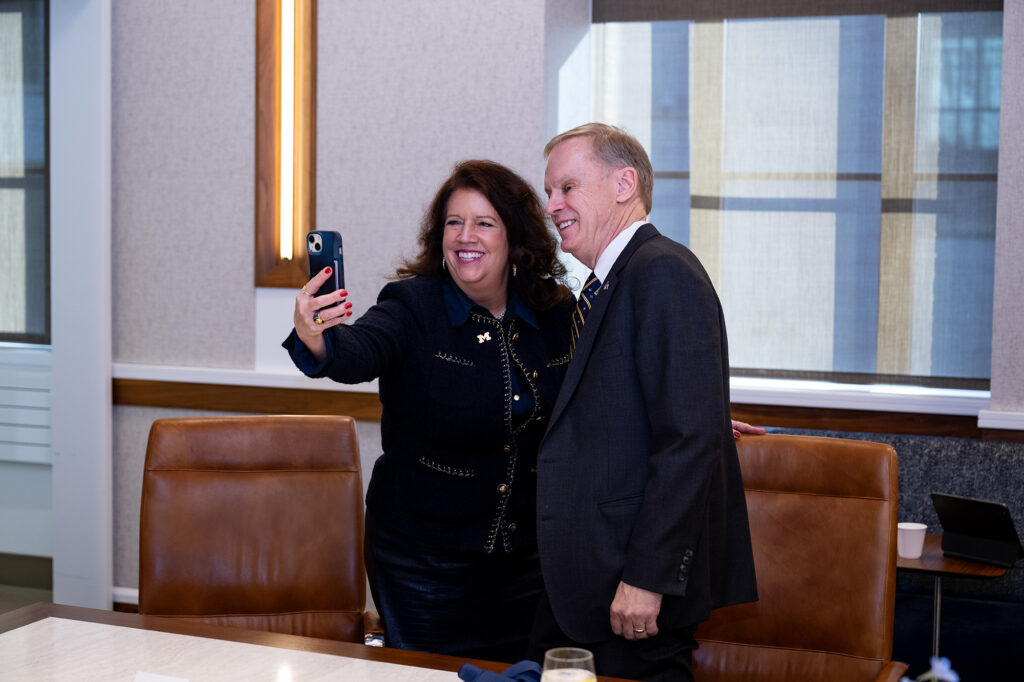 A man and a woman take a selfie together