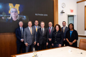 From left, Regents Denise Ilitch (on screen), Paul Brown, Carl Meyers, Michael Behm, President-elect Kent Syverud, Regents Carl Bernstein, Sarah Hubbard, Jordan Acker and Katherine White. (Eric Bronson, Michigan Photography)